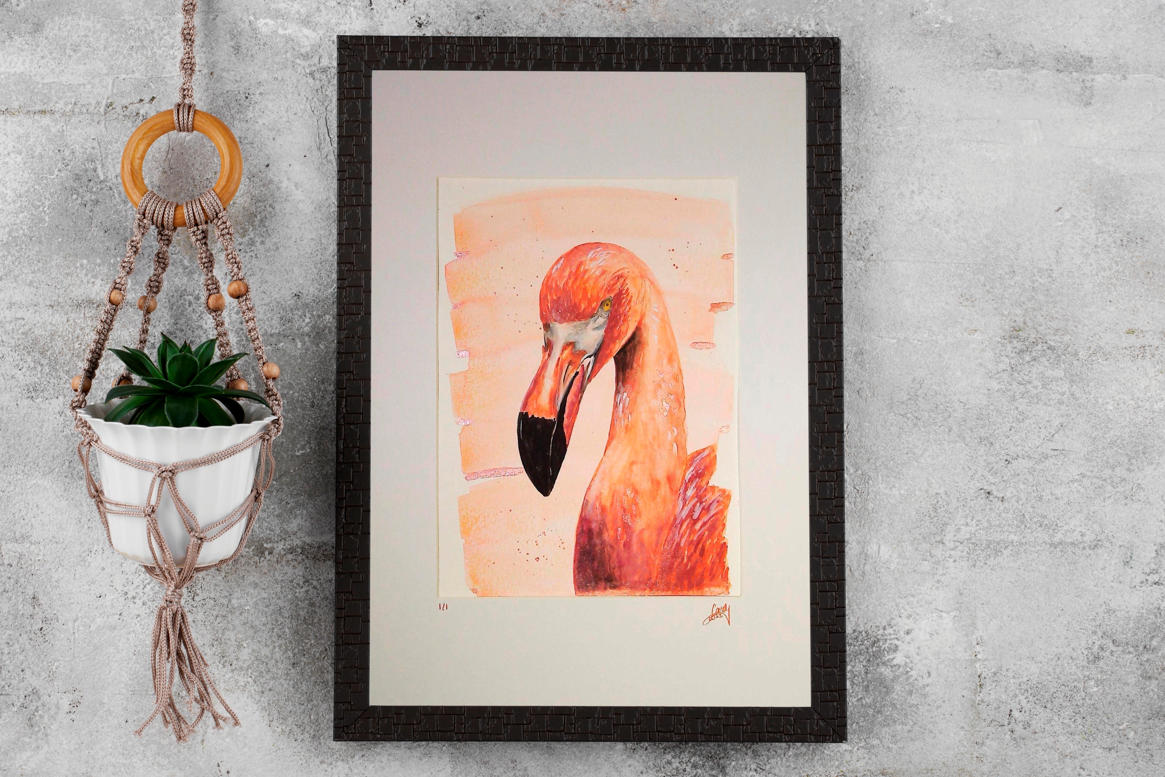 Framed artwork of a flamingo on a textured wall with a macrame plant holder.