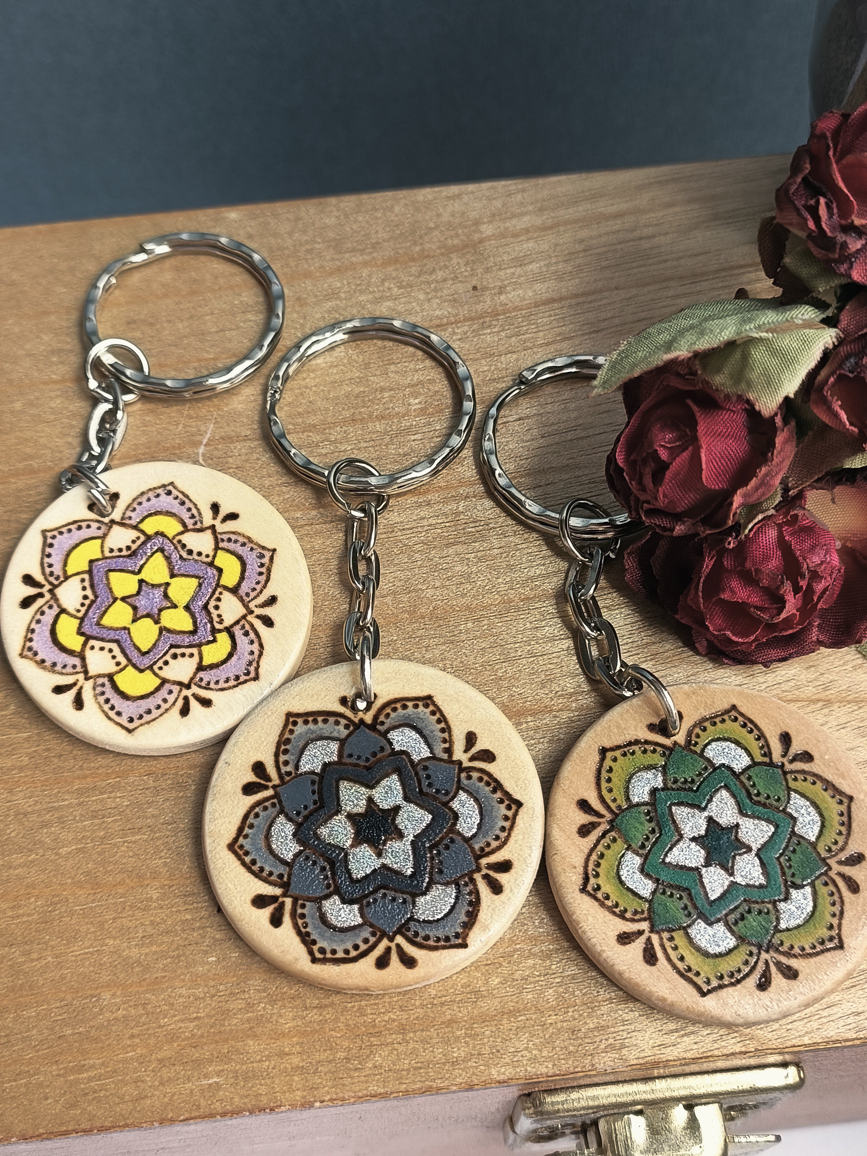 The Arches design versions: Shimmery Lilac (and yellow), a greyscale version with holographic details, and a green version with holographic details.