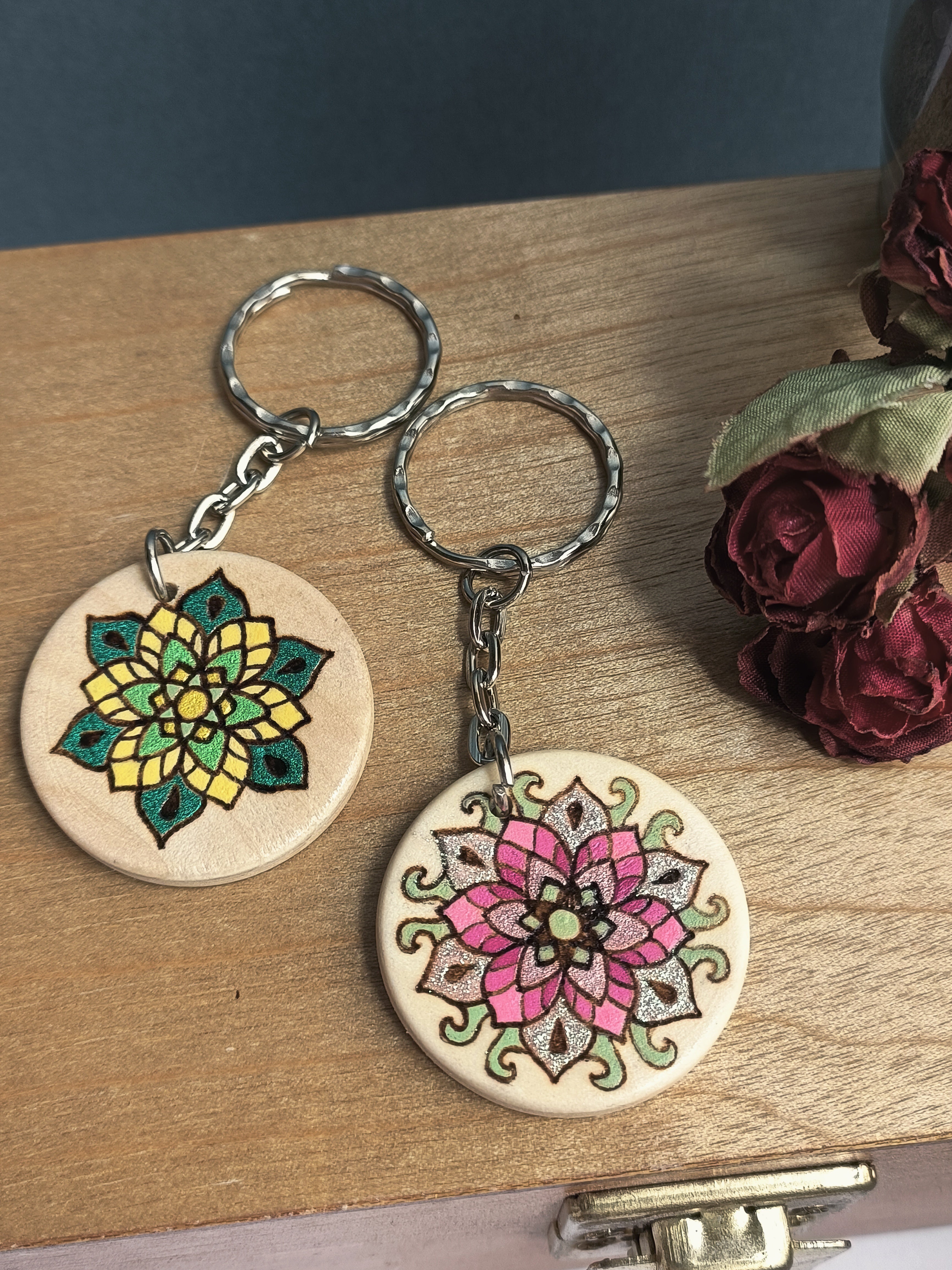 The two Flower designs, one shimmer green (and yellow), and the other pink with colour-shifting rose-green shimmer.