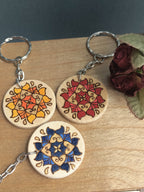 The three colour versions of the Tile design: Yellow, Red, and Blue, each with shimmery gold details.