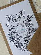 Example photo of the cat holding a personalised envelope between its teeth. The personalisation reads "For Mummy".