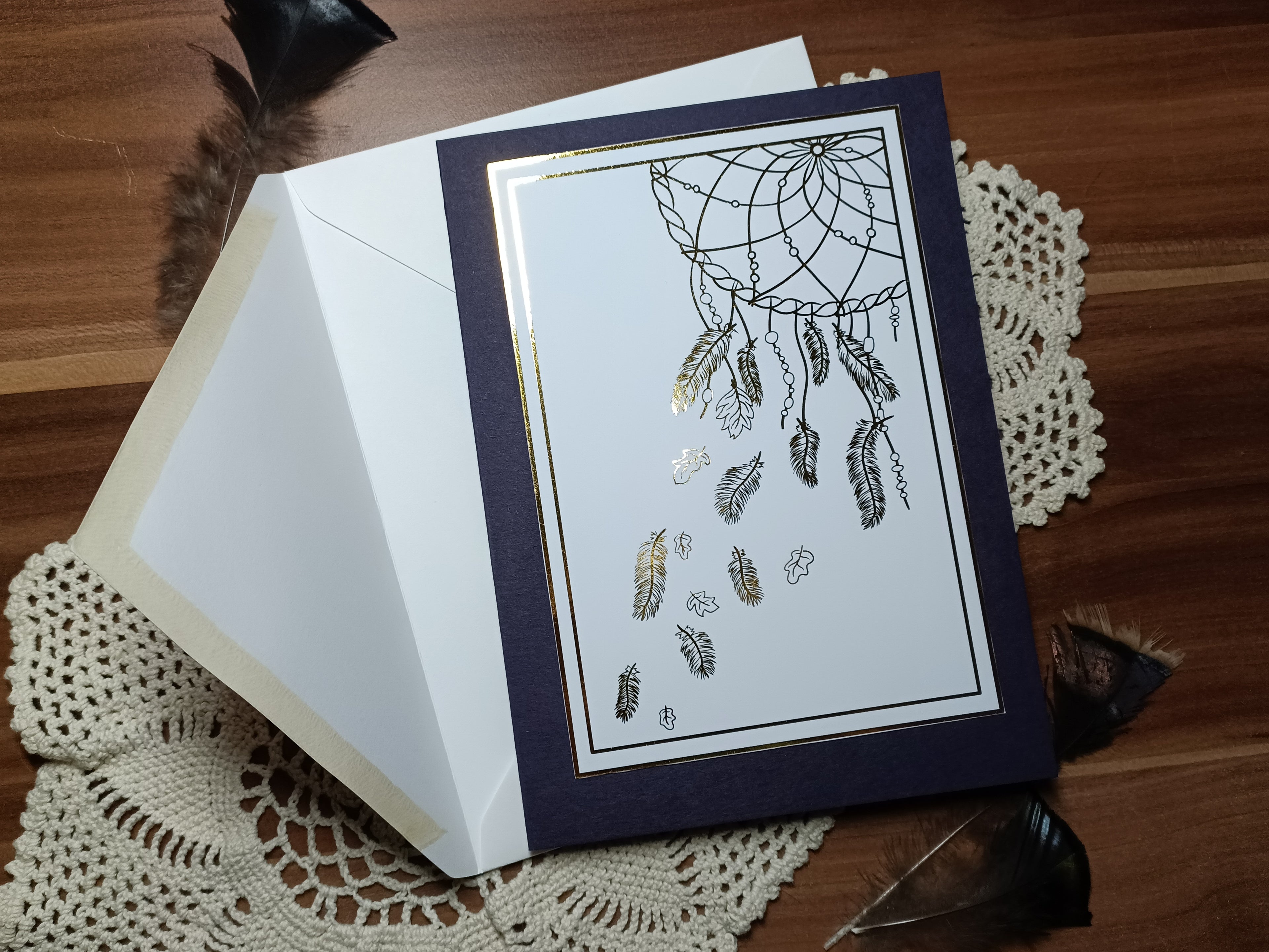 The dark violet card with gold foil on white. The accompanying envelope for this card is white.