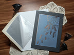 A darker grey colour scheme with rose-gold foil. The accompanying envelope is white with silver inlay.