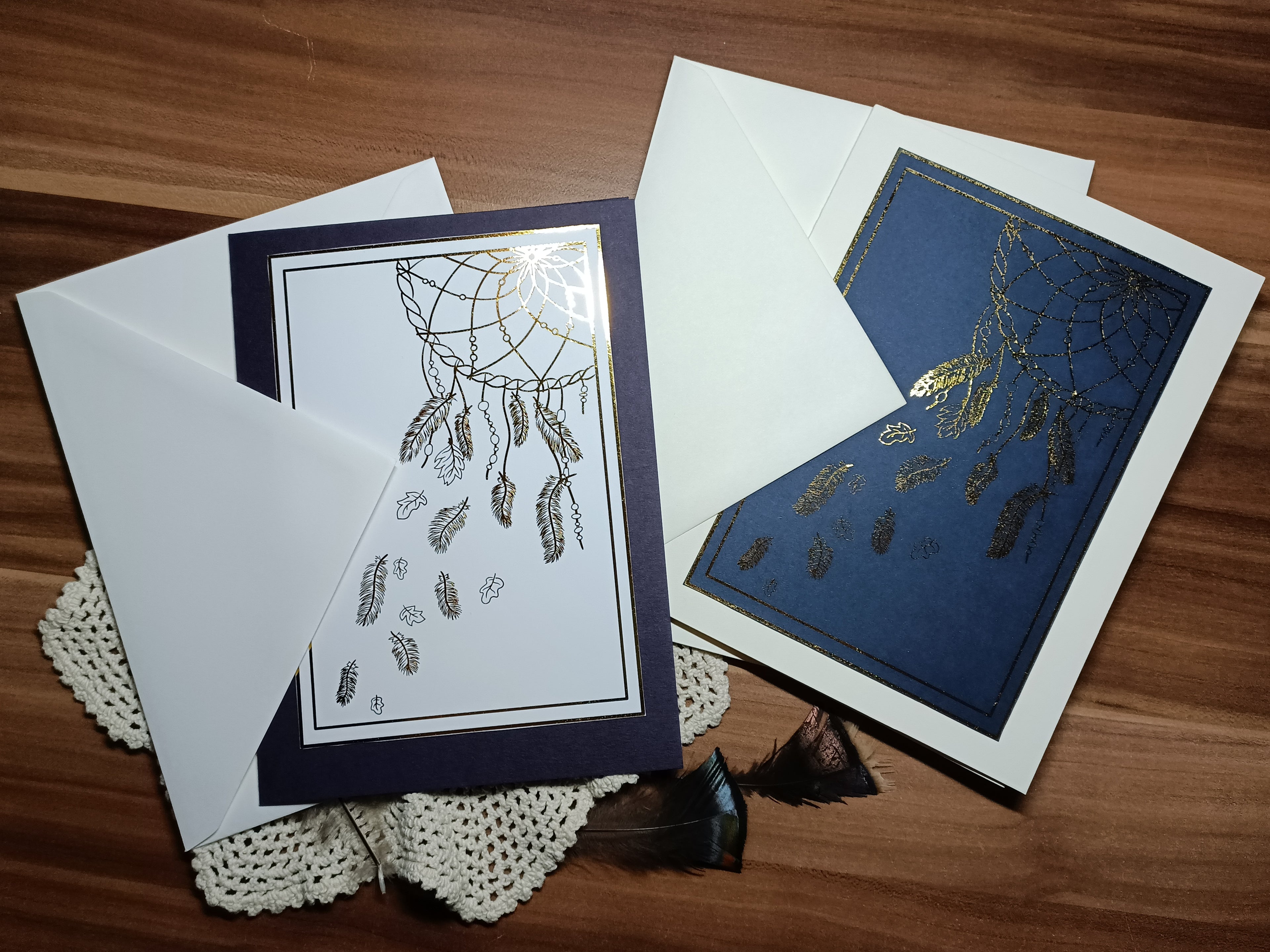 The violet/gold and navy/gold cards with their envelopes. 