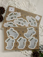 Two sheets of Christmas-themed sticker labels, one sheet showing the Banner labels, the other sheet the Scroll labels.