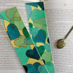 Two green watercolour hearts bookmarks next to each other, one with glitter orange and one with glitter green outlines.