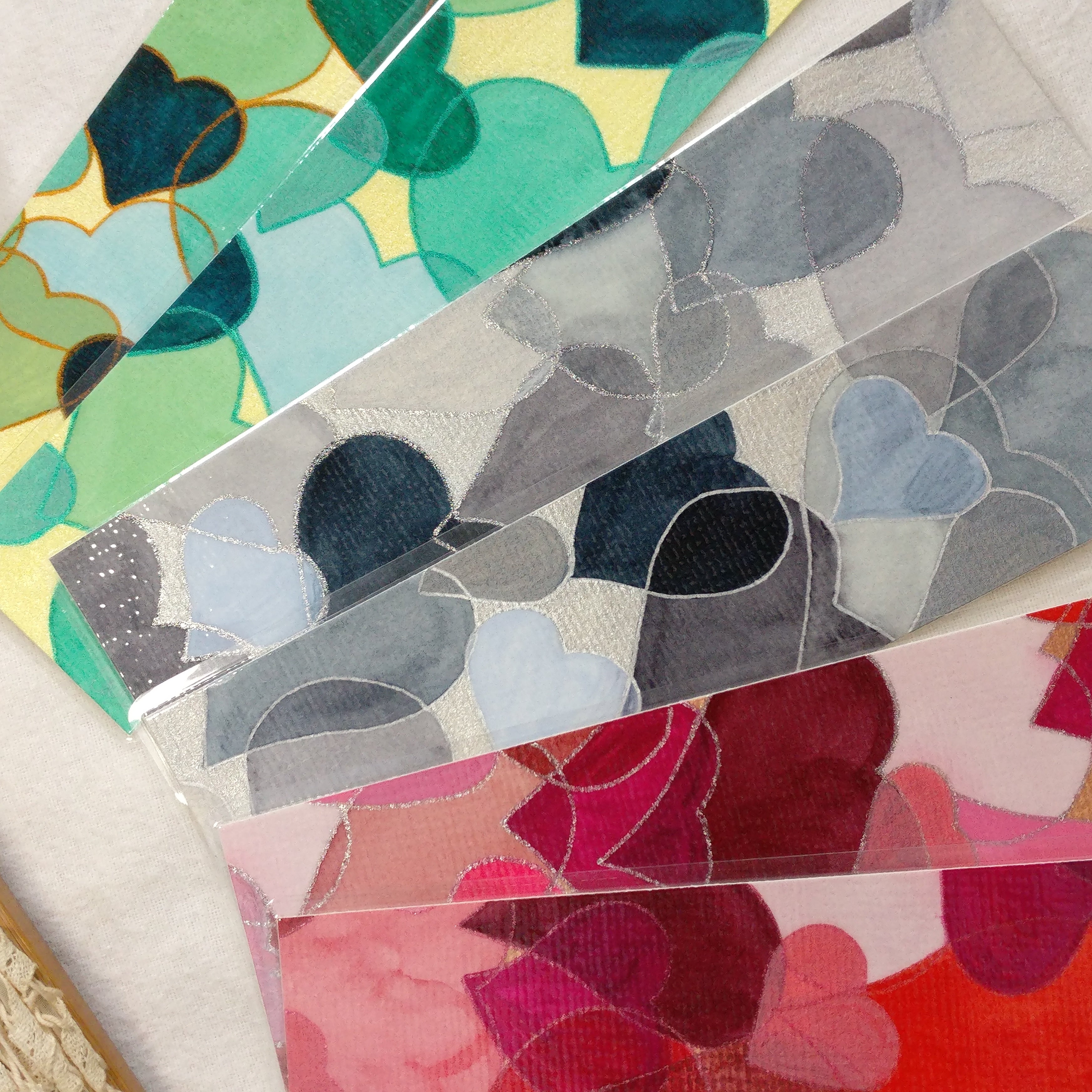 Colour swatches with abstract heart patterns in various colors.