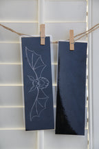 The medium Shadow Bat Bookmark showing the foiled front and simple, non-fabric backside.