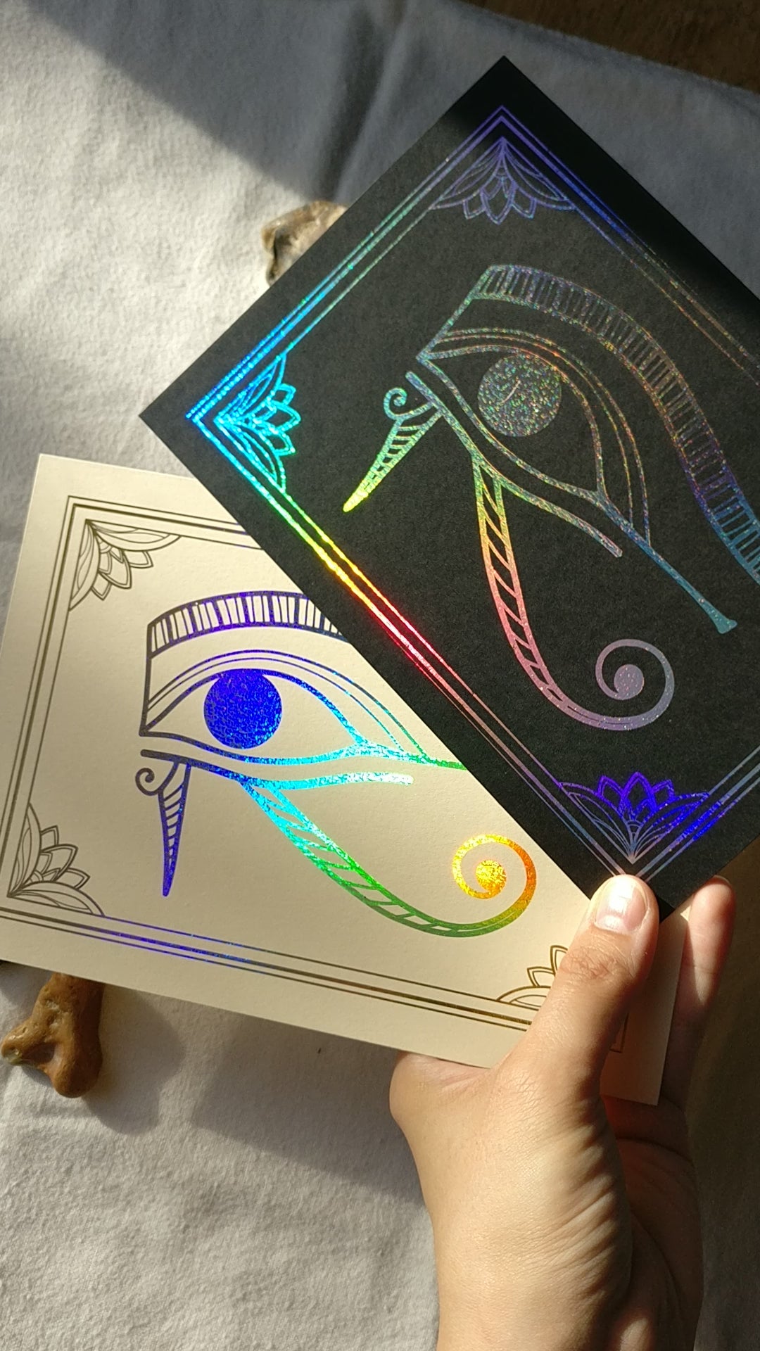 Demonstrating the foil effect of two prints in sunlight.